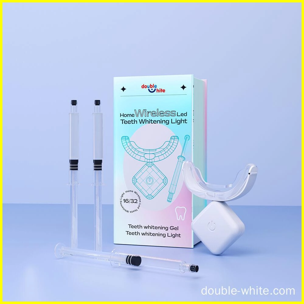 A teeth whitening kit that includes a wireless LED light, two syringes of teeth whitening gel, and a teeth whitening mouth tray.