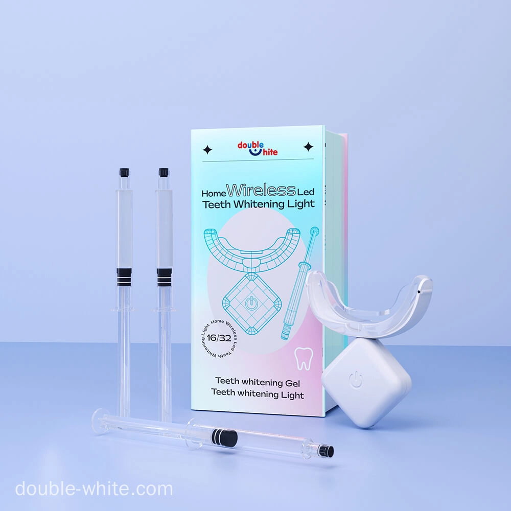 A teeth whitening kit that includes a wireless LED light, two syringes of teeth whitening gel, and a teeth whitening mouth tray.