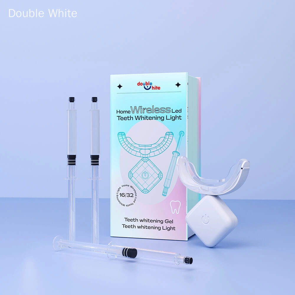 A teeth whitening kit that includes a wireless LED light, two syringes of teeth whitening gel, and a teeth whitening mouth tray.