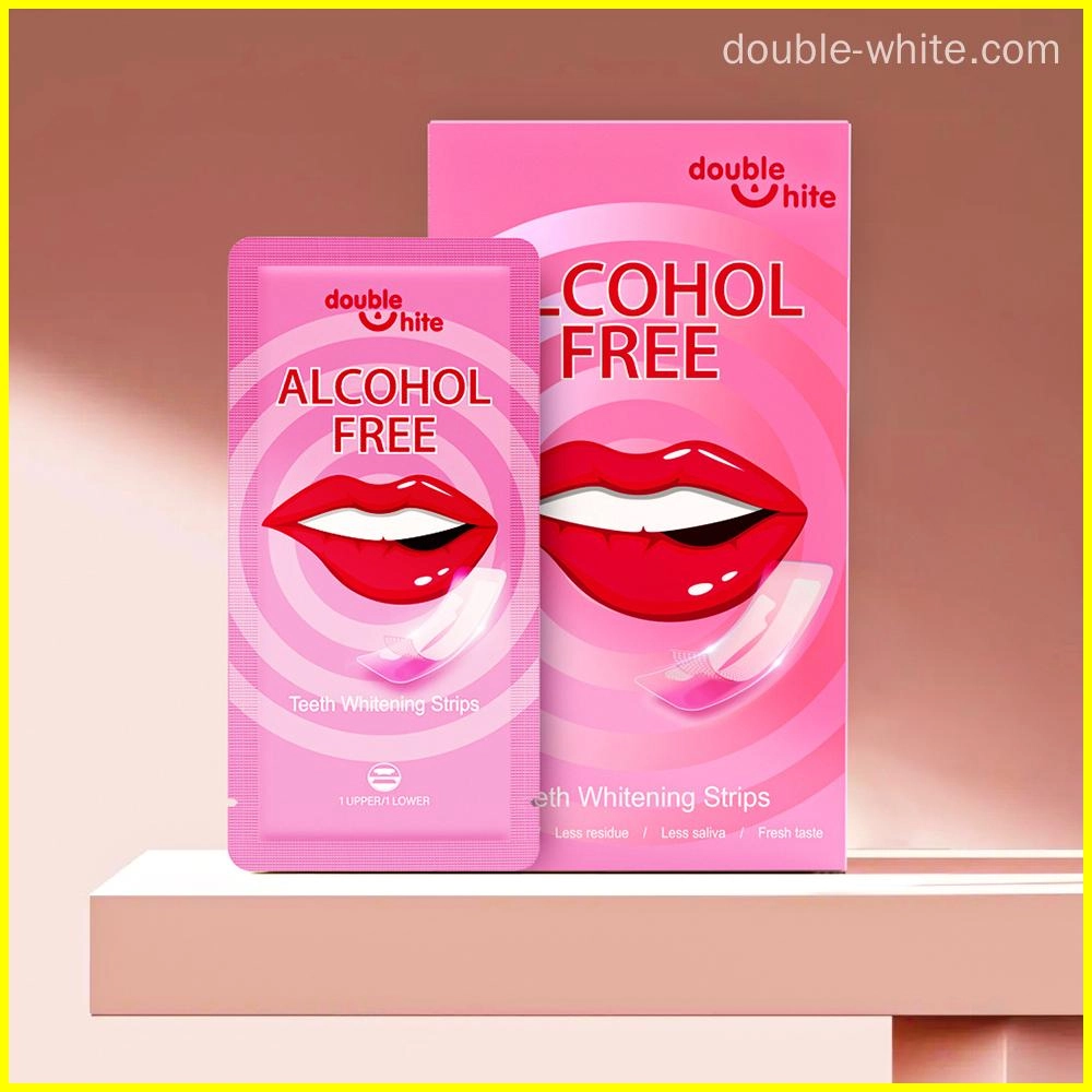 A box of Double White teeth whitening strips. The box is pink and white. The front of the box has the Double White logo, the product name, and a list of the product's benefits.