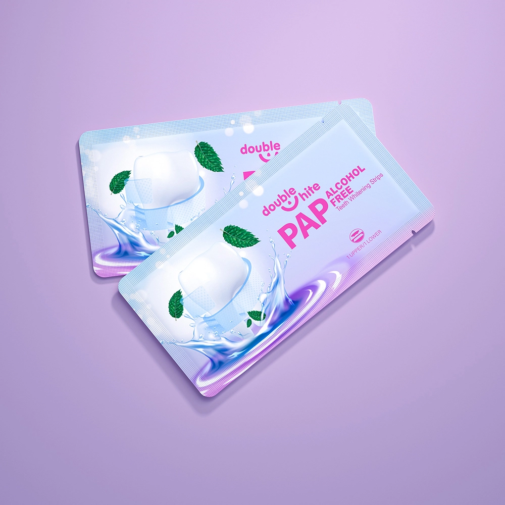 A product image of Double White PAP Free Alcohol Free Teeth Whitening Strips. The packaging is white and purple with a picture of a smiling mouth with two green mint leaves.