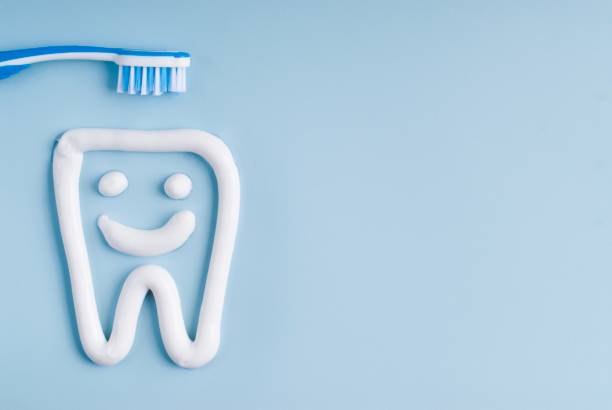 Here's a descriptive alt text for the image:

Smiling toothpaste tooth with toothbrush