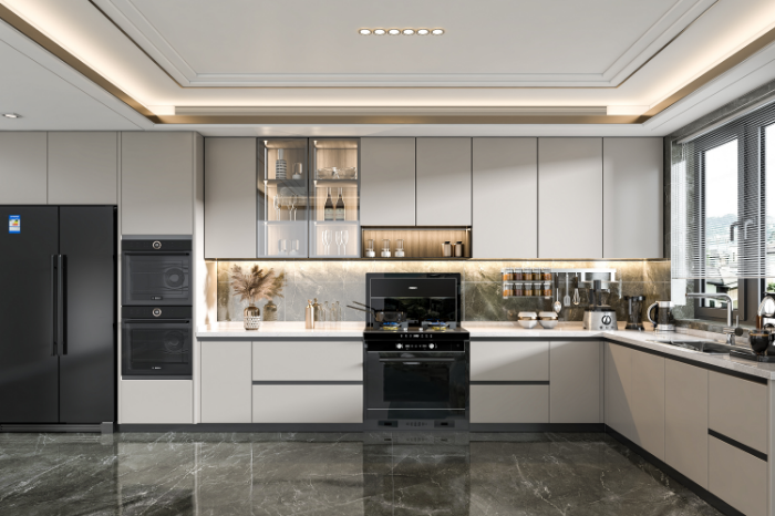 Modern kitchen with gray cabinets, black appliances, and marble tile floor.