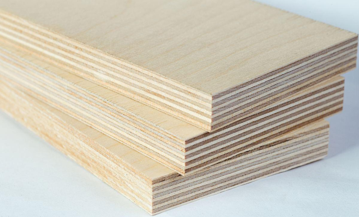 Stack of three light-colored birch plywood boards showing layered edges.