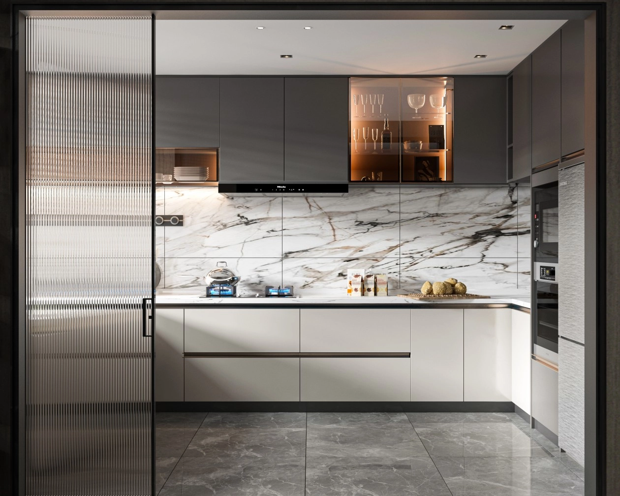 Modern kitchen with marble backsplash, grey cabinets, and fluted glass door.