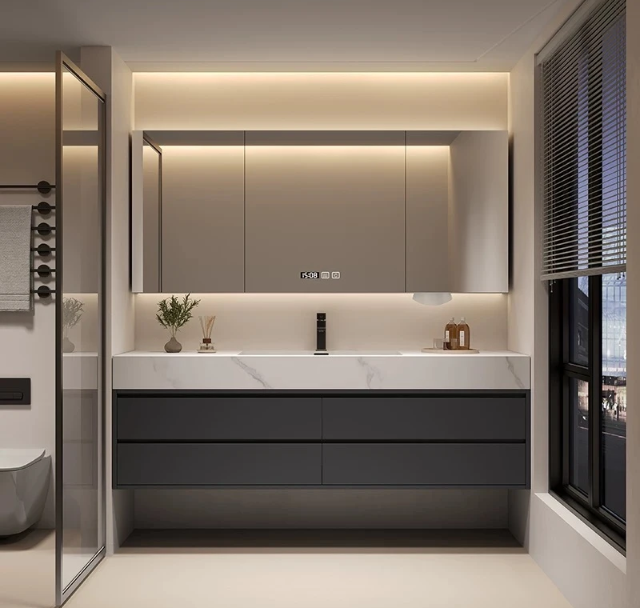 Modern minimalist bathroom with a backlit circular mirror and glass shower.