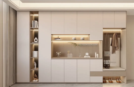 Modern cream entryway cabinet with built-in shelving, lighting, and coat rack.