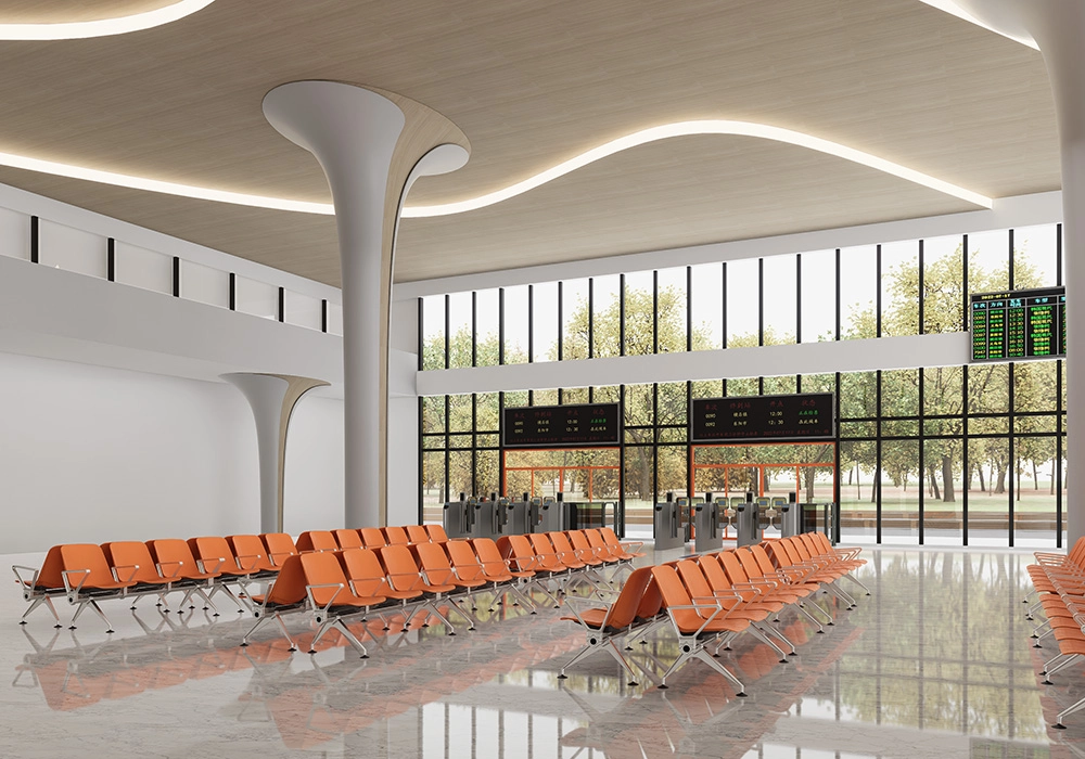 Modern waiting area with orange chairs, large windows overlooking a park, and digital departure boards.