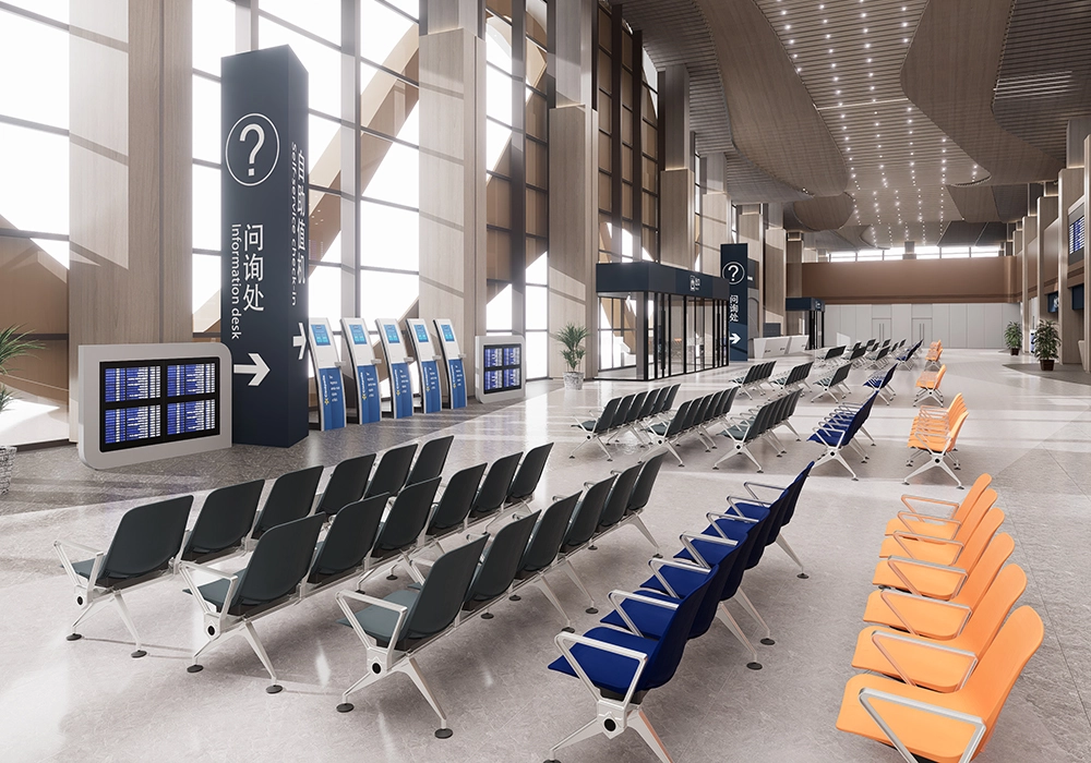 Modern airport waiting area with rows of gray and blue chairs, digital information displays, and signage indicating the location of the information desk.