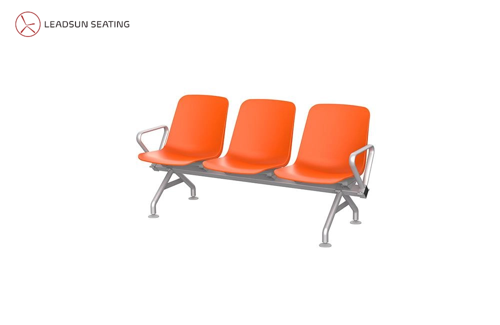 waiting room airport public chair Three-seat orange plastic waiting bench with silver metal frame.