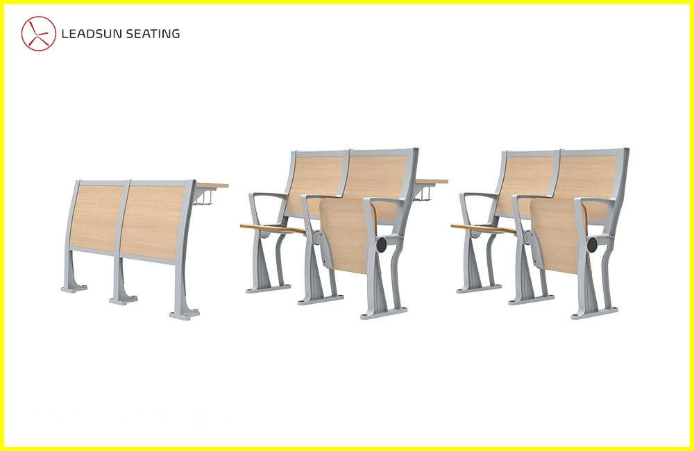 public-place-seating-chair Three light gray and beige lecture hall chairs with attached writing surfaces and a separate, matching writing surface.