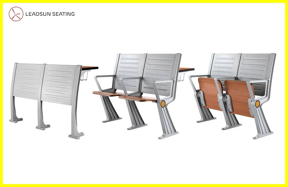 University-desk-manufactures Two-seater lecture hall chairs with attached writing tablets and individual fold-up desks.