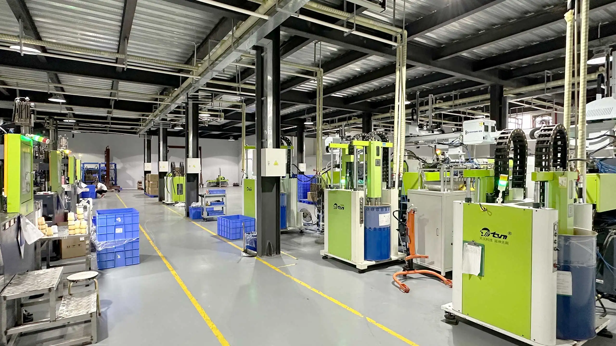 TYM factory floor with LSR injection molding machines and automation equipment - TYM