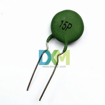 A green, round PTC 15P thermistor with two silver leads. The thermistor has a "15P" printed on its surface. The thermistor is isolated on a white background.