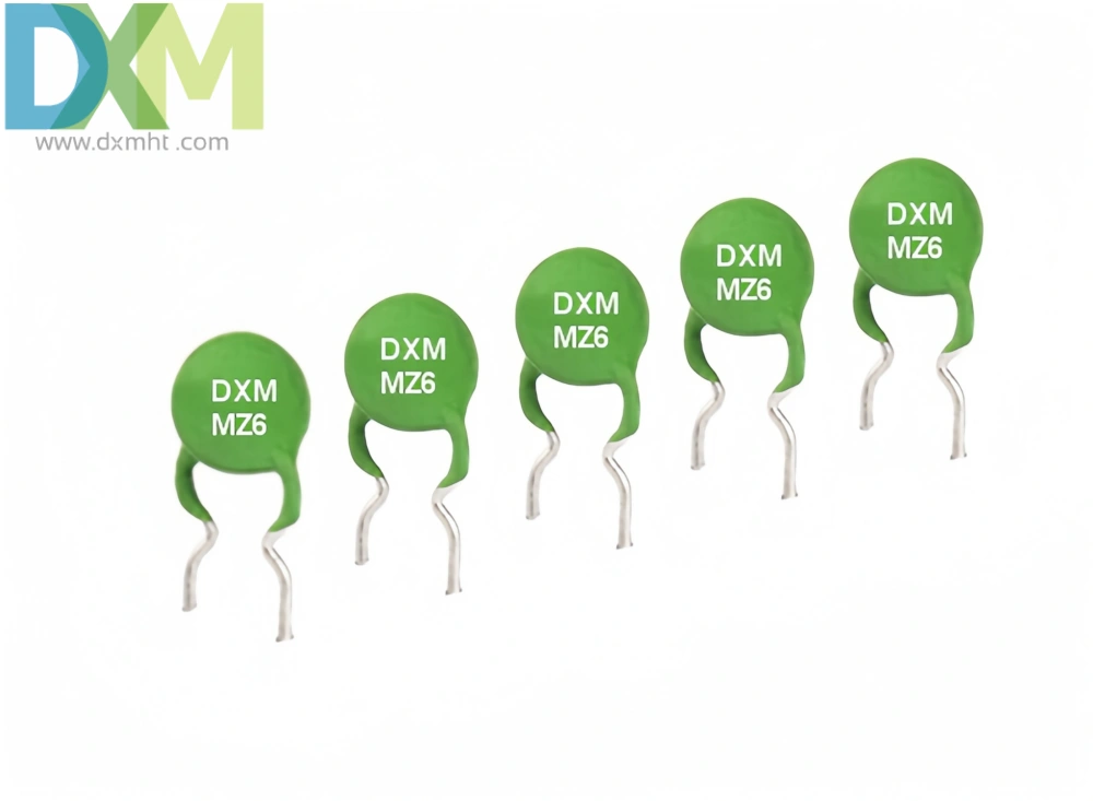 Five green Precision Thermistor PTC Device components for circuit protection of RS485,232 with silver leads and marked with "DXM MZ6".