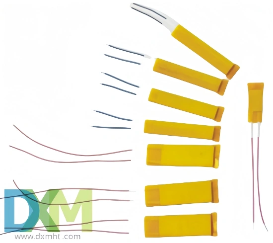 Assortment of PTC heating elements shown with various lead wire configurations.  Yellow encased elements are displayed individually and as a group.