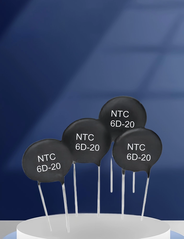 Four black NTC 6D-20 thermistors on white surface.