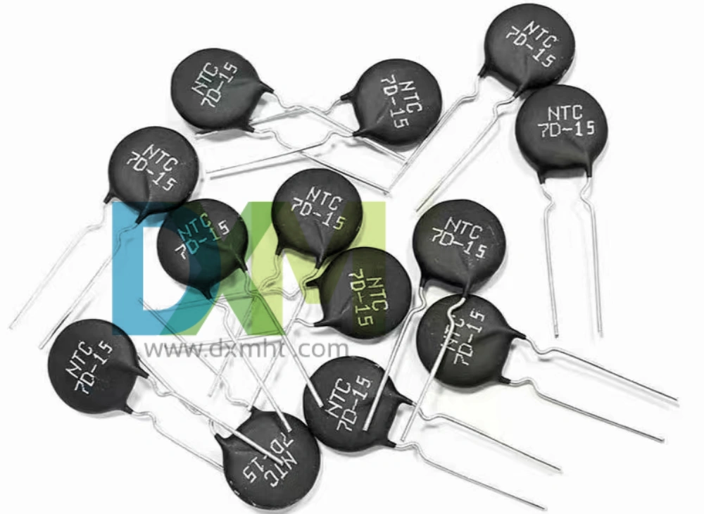 A group of black 7D-15 NTC Thermistors with silver leads on a white background,which have Thermistor B Value.