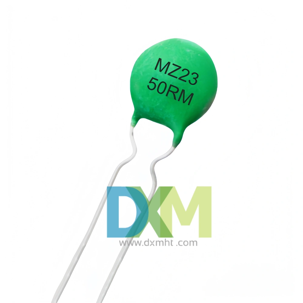 A green PTC Element MZ23 50RM with silver leads against a white background.