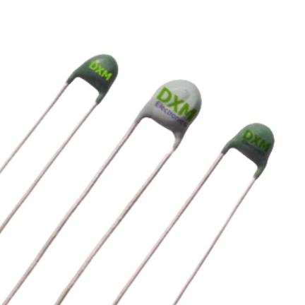 Three Positive Temperature-Dependent Resistor components, with green and white ceramic bodies. The resistors have silver leads and are labelled DXM,which showing you PTC meaning.