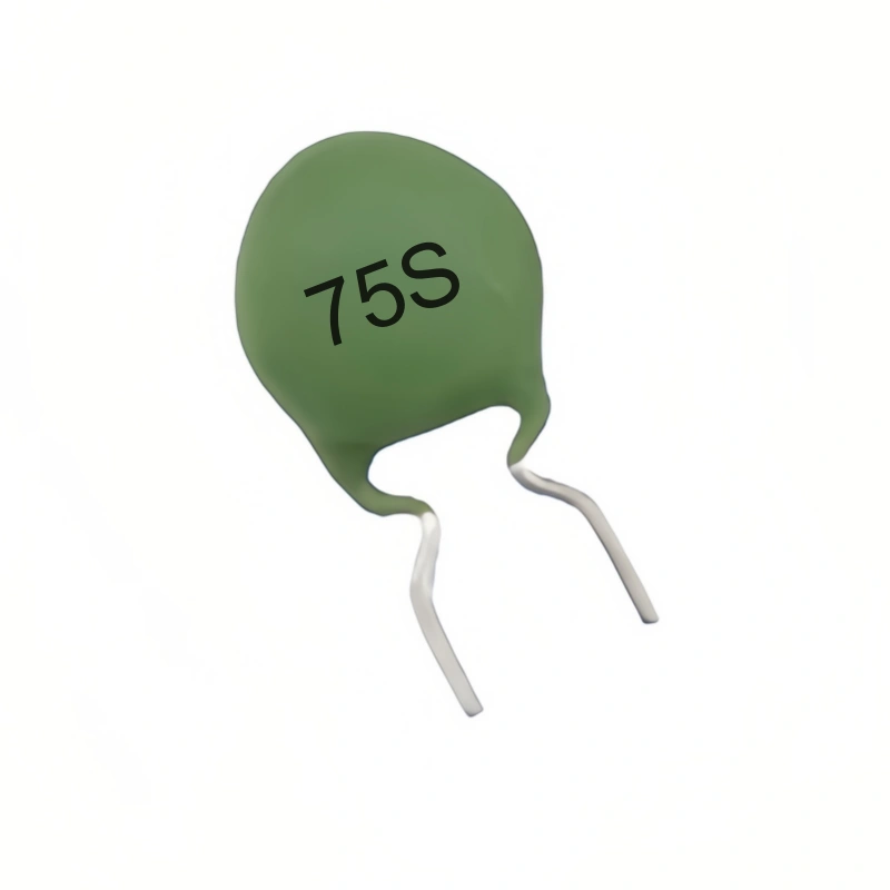 A single green WMZ12A 75S PTC thermistor with silver leads.  The thermistor is a small, round component used in electronic circuits.