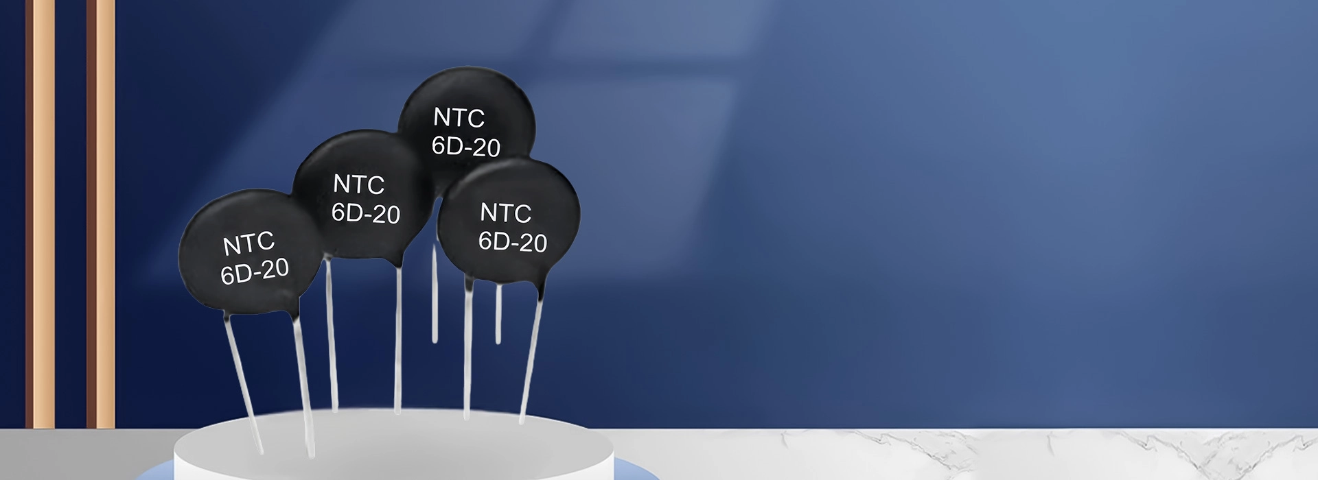 Four black 6D-20 NTC thermistors on white sticks on a white pedestal against a blue background.