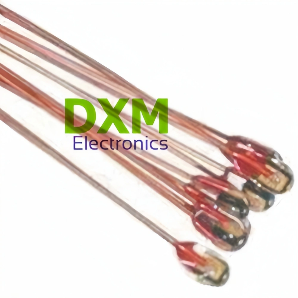 Close-up of five high precise glass Bead Thermistor components MF58D with red and brown bodies and silver tips, sold by DXM Electronics.