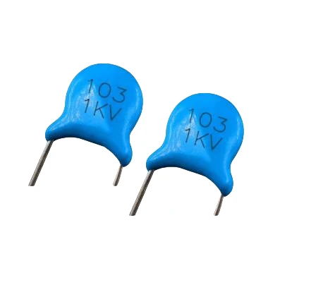 Two blue AC Capacitors, marked "103 1KV", shown against a white background.