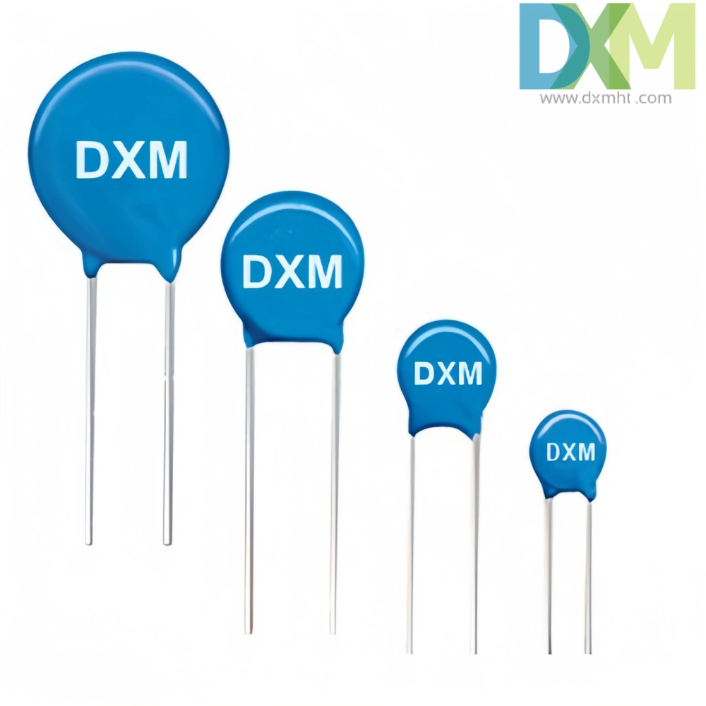 A row of four blue Varistors surge protectors of different sizes with "DXM" printed on them.  They are mounted on white background.