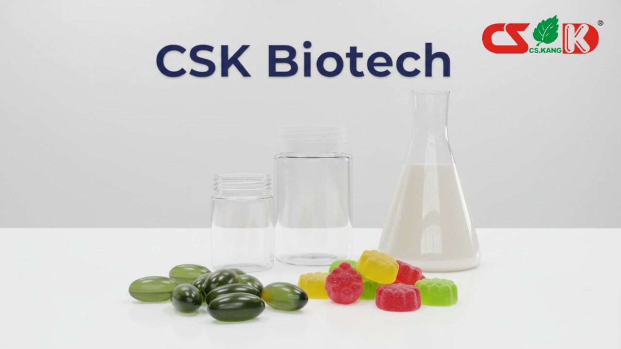 A collection of various supplement dosage forms like gummies and softgels in a modern lab with the CSK Biotech brand visible on the wall.