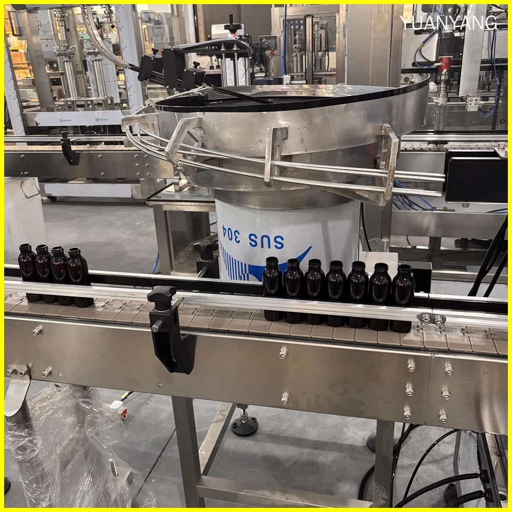 vibrotary cap feeder