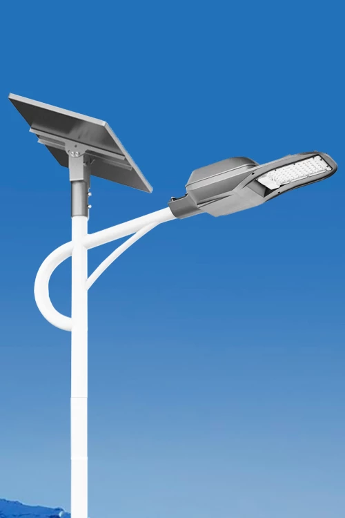 Solar-powered LED street light against a clear blue sky.