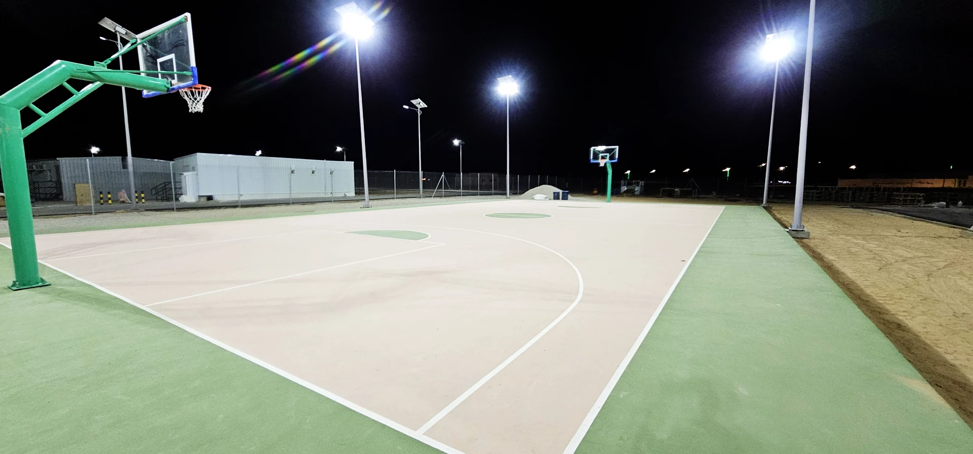 Outdoor solar lighting system installation for basketball court