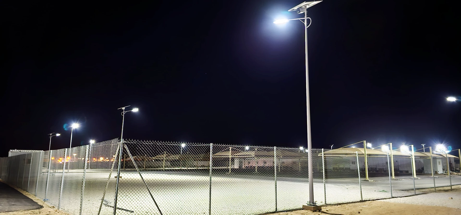 Solar street lights illuminating industrial park roads at night