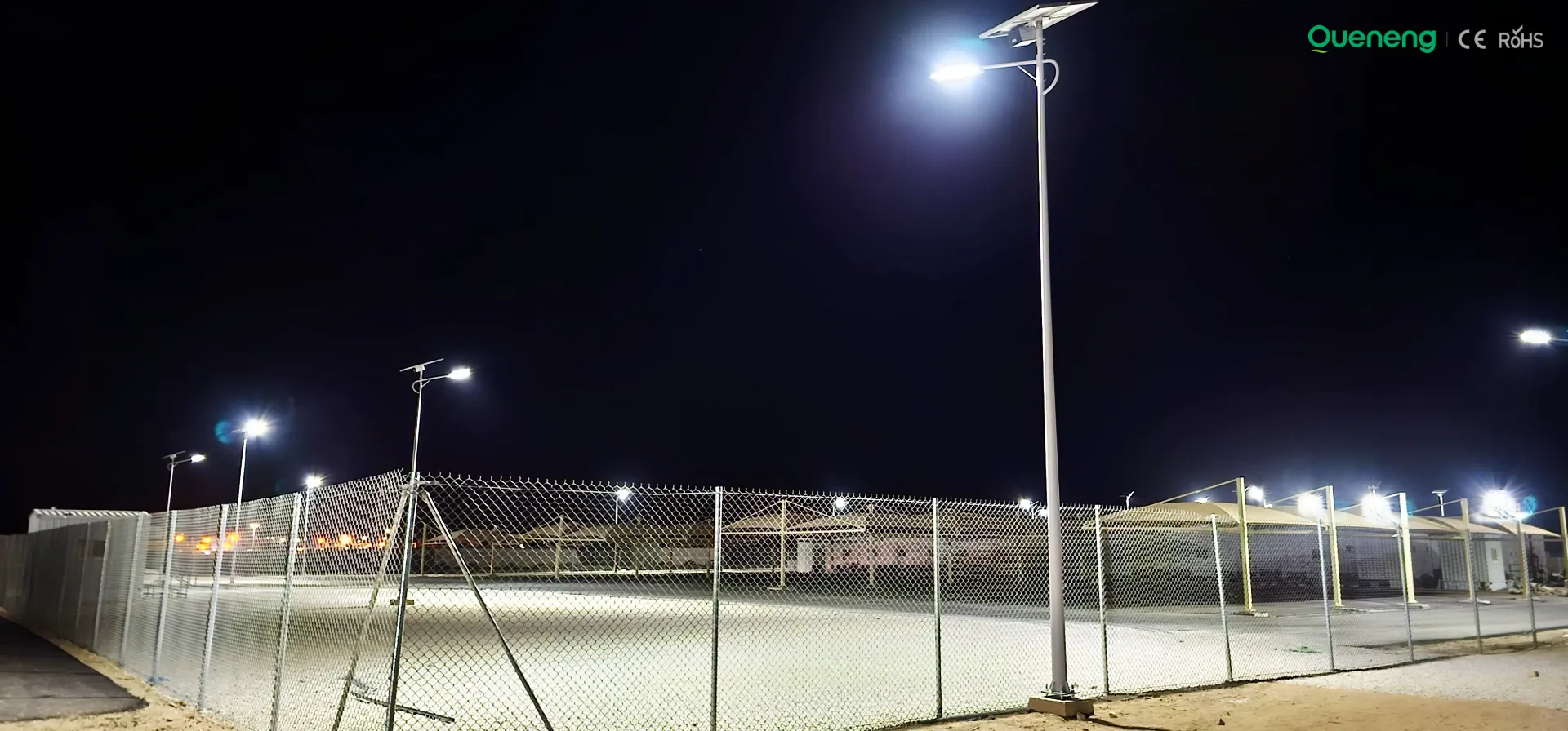 Solar street lights illuminating industrial park roads at night Solar street lights illuminating industrial park roads at night