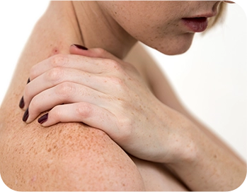 midsection-shirtless-woman-with-short-hair-suffering-from-shoulder-pain-against-white-background