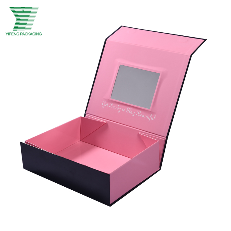 Open pink and black magnetic gift box with an interior mirror.