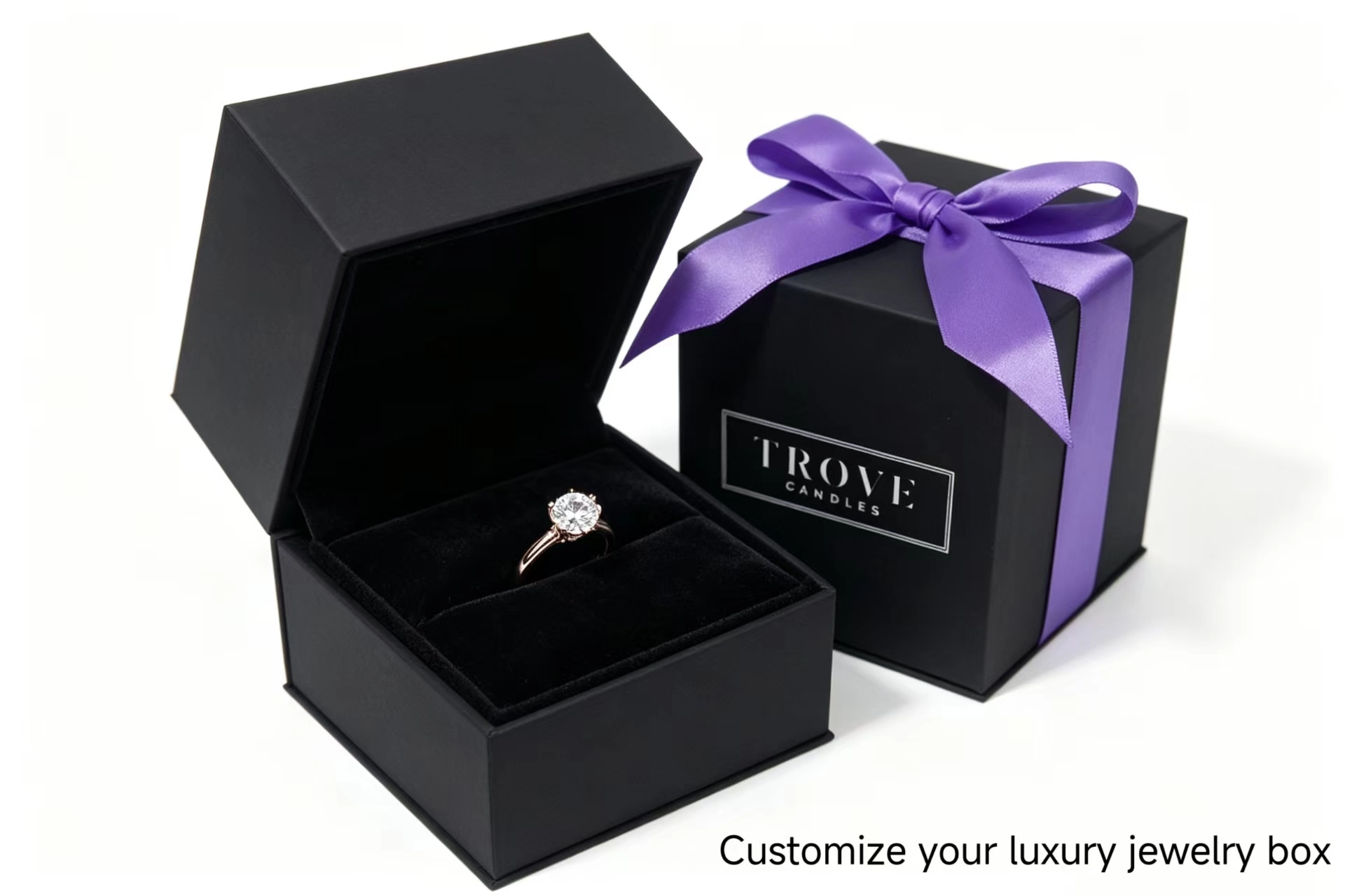 Diamond ring in a black jewelry box next to a gift box with a purple ribbon. - Yifeng Packaging