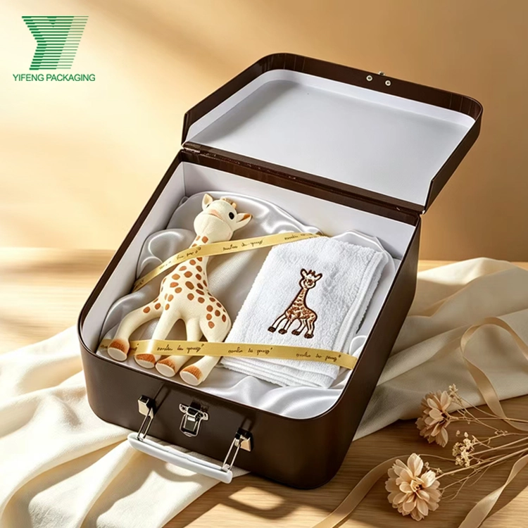 Baby gift set with giraffe toy and towel in a brown suitcase box. - Yifeng Packaging