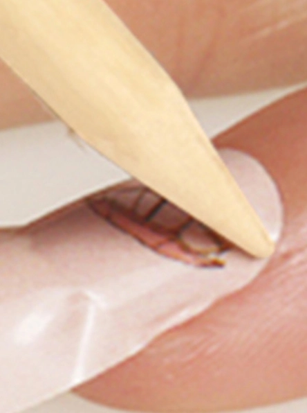 press edges wooden stick